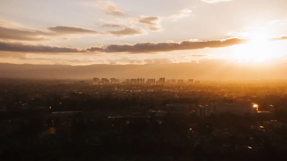 The San Jose skyline in the Santa Clara Valley at sunset, seen from above